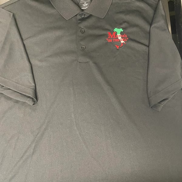 Black polo shirt with "Mama's ON THE HILL" logo featuring the Italian flag colors.